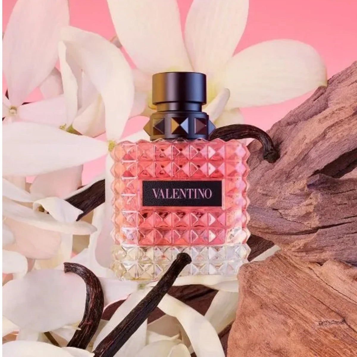 Refect Beauty Valentino Donna Born In Roma perfume bottle with rockstud glass texture surrounded by jasmine and wood