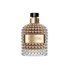 Refect Beauty Valentino Uomo Eau de Toilette in a glass bottle with gold accents and a textured stud design.