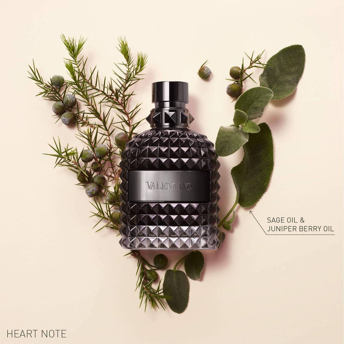 Refect Beauty Valentino Uomo Intense eau de parfum bottle surrounded by sage and juniper berries on a beige background