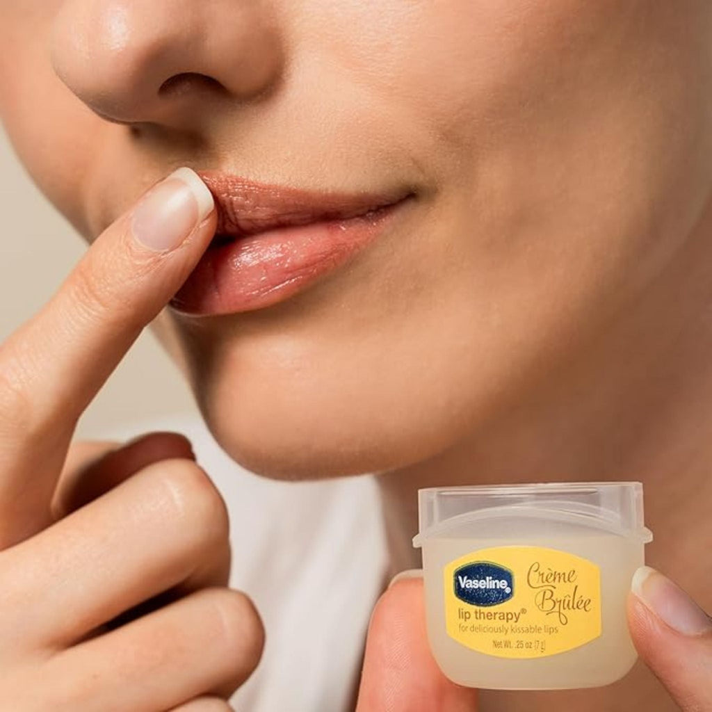 Refect Beauty Vaseline Lip Therapy Crème Brûlée balm being applied to lips for moisture and soft, smooth results