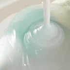 Refect Beauty AXIS-Y Vegan Collagen Eye Serum with a lightweight, translucent blue gel texture being dispensed.