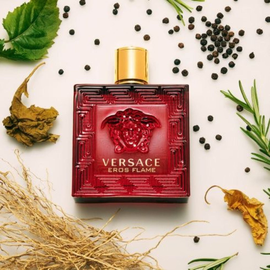 Refect Beauty Versace Eros Flame red glass perfume bottle with Medusa emblem surrounded by spices and herbs