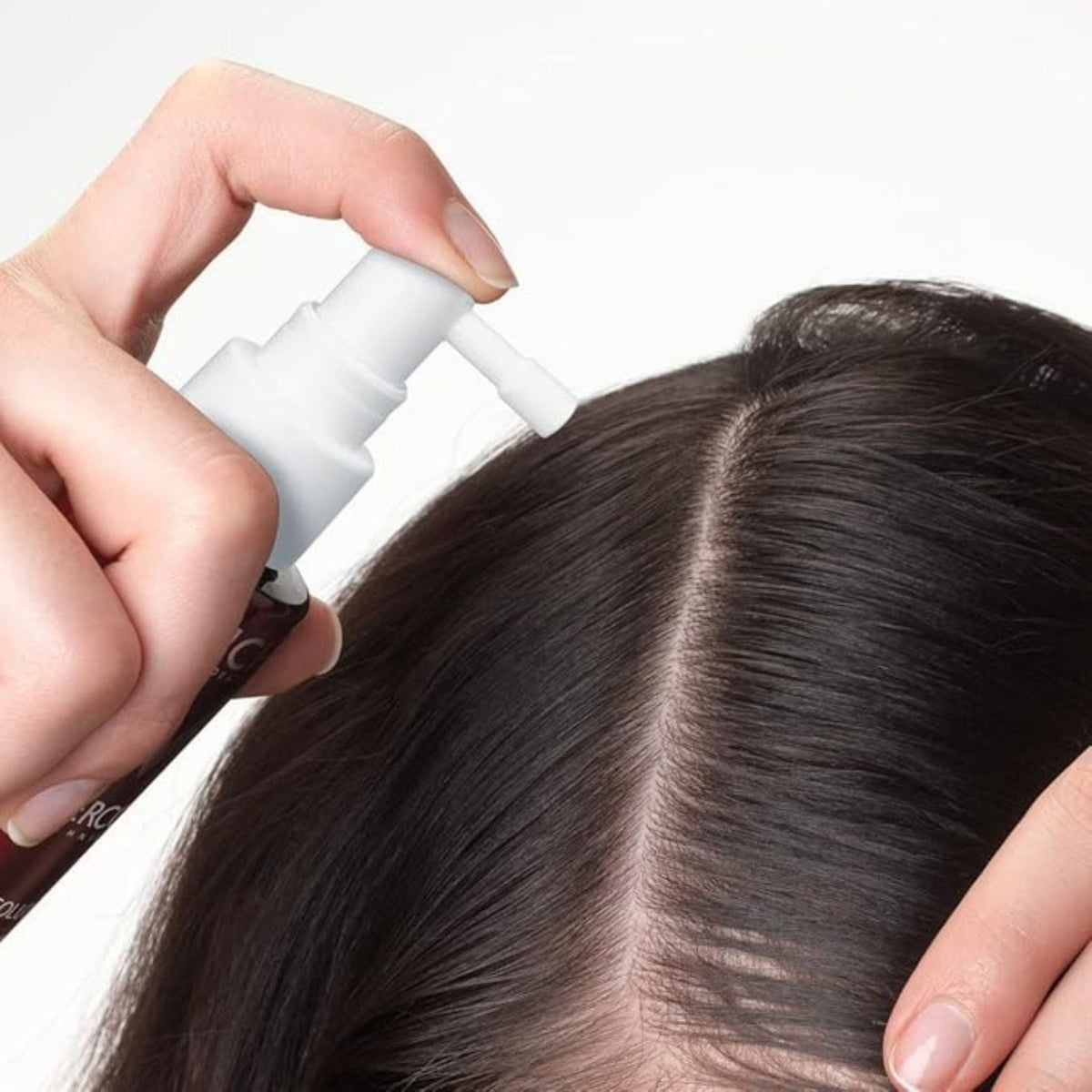Refect Beauty Vichy Dercos Densi-Solutions hair thickening concentrate being applied to a scalp parting
