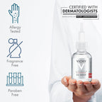 Refect Beauty Vichy H.A Epidermic Filler Serum bottle held in hand with icons for allergy, fragrance, and paraben free