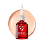 Refect Beauty Vichy Liftactiv B3 dark spots serum in a red glass bottle with a dropper against a peach serum splash.