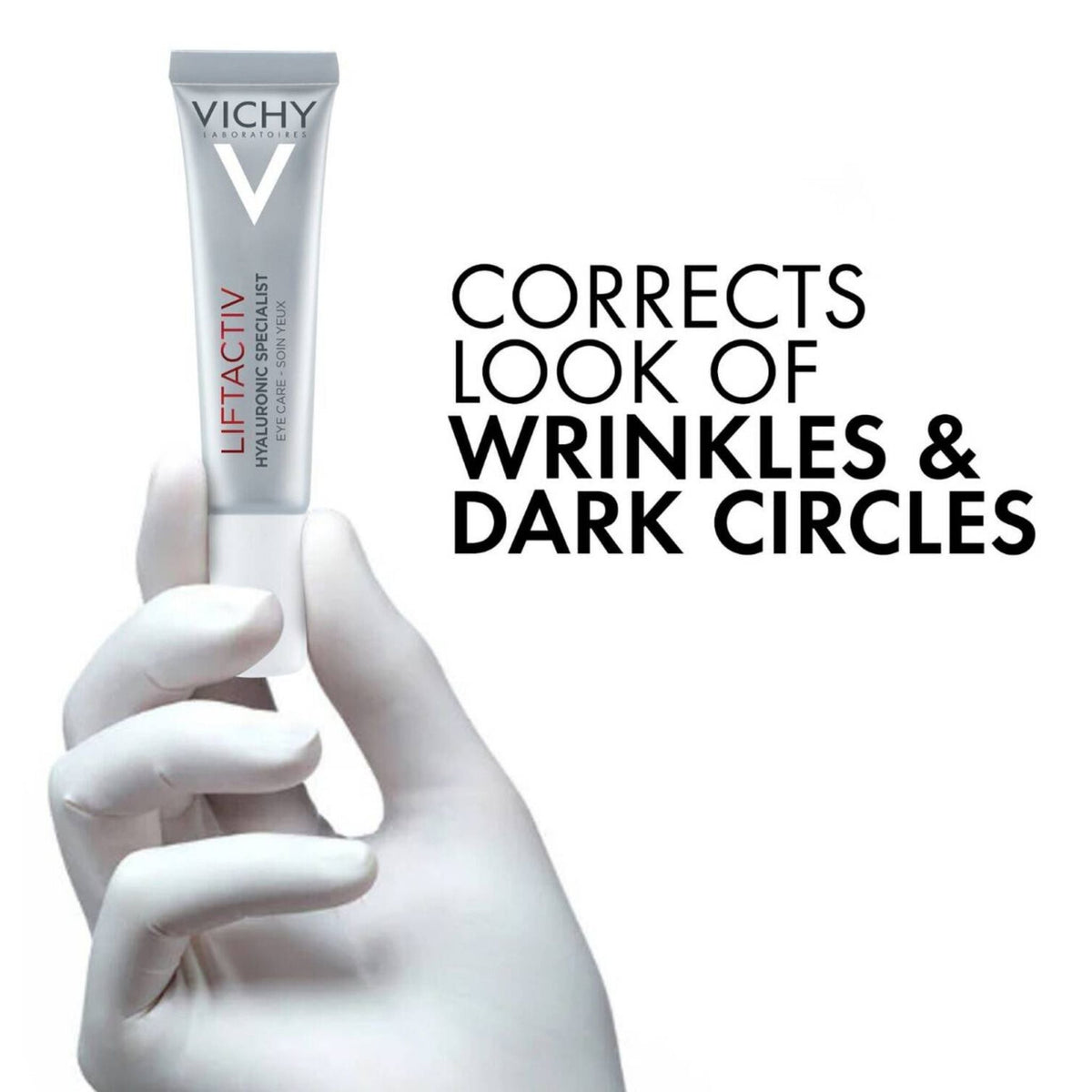 Refect Beauty hand in white glove holding a tube of Vichy Liftactiv Eyes Supreme anti-aging eye cream.