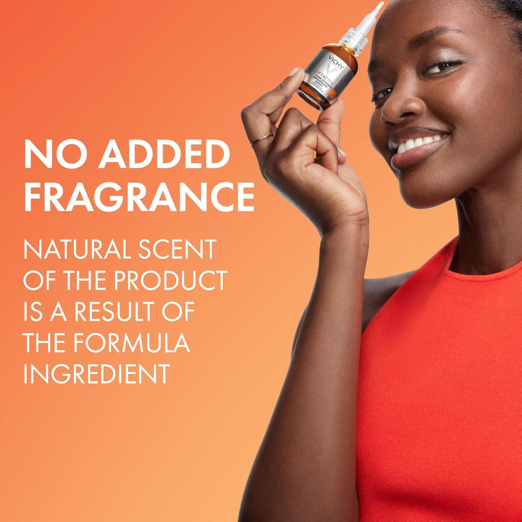 Refect Beauty model holding a bottle of Vichy Liftactiv Vitamin C Serum against an orange background