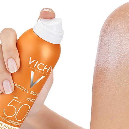 Refect Beauty Vichy Capital Soleil SPF 50 hydrating sunscreen mist being sprayed onto skin for invisible protection