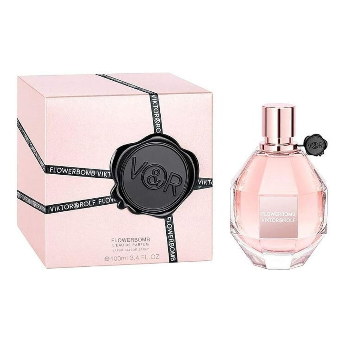 Refect Beauty Viktor & Rolf Flowerbomb Eau de Parfum in a faceted glass bottle next to its light pink branded box.
