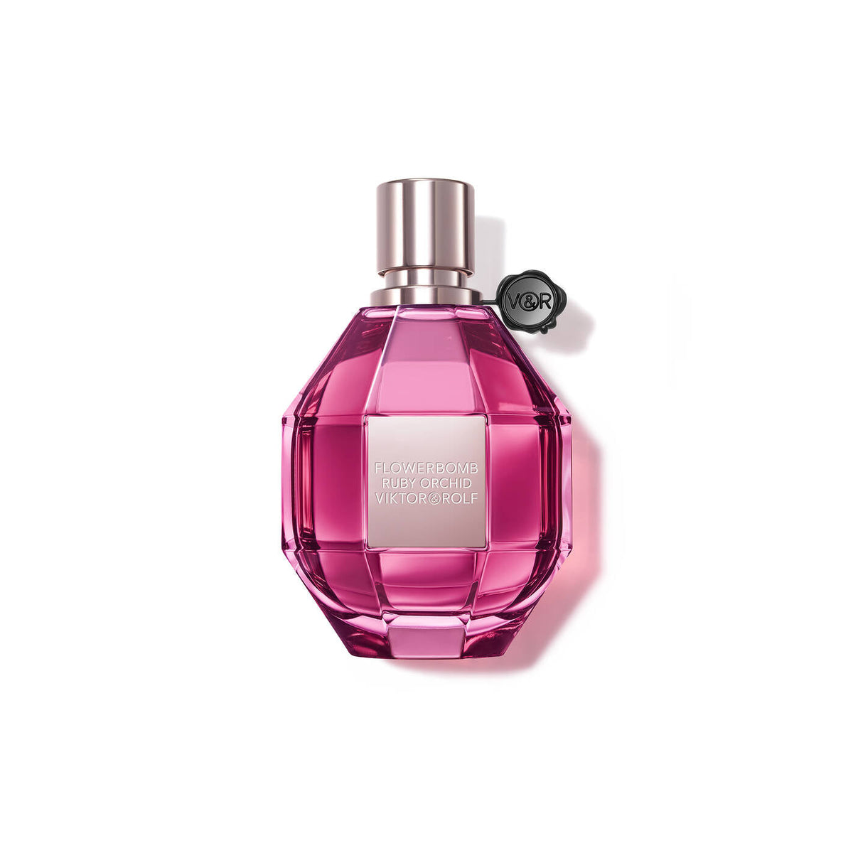 Refect Beauty Viktor & Rolf Flowerbomb Ruby Orchid perfume in a faceted pink glass bottle with a black seal.
