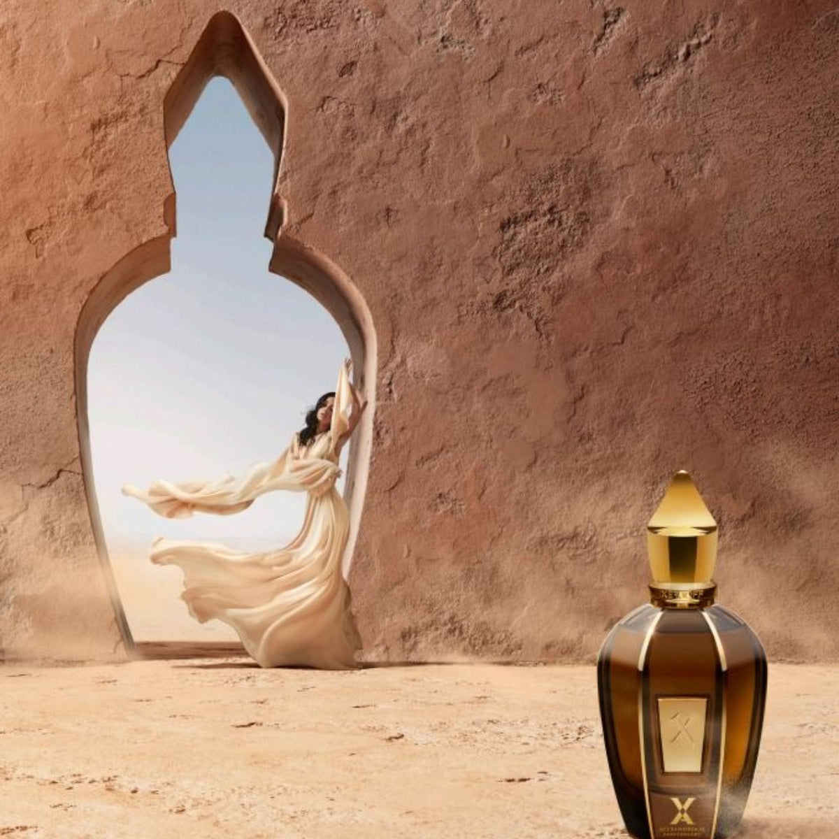 Refect Beauty Xerjoff Oud Stars Alexandria II perfume bottle in a desert setting with a woman in a flowing dress