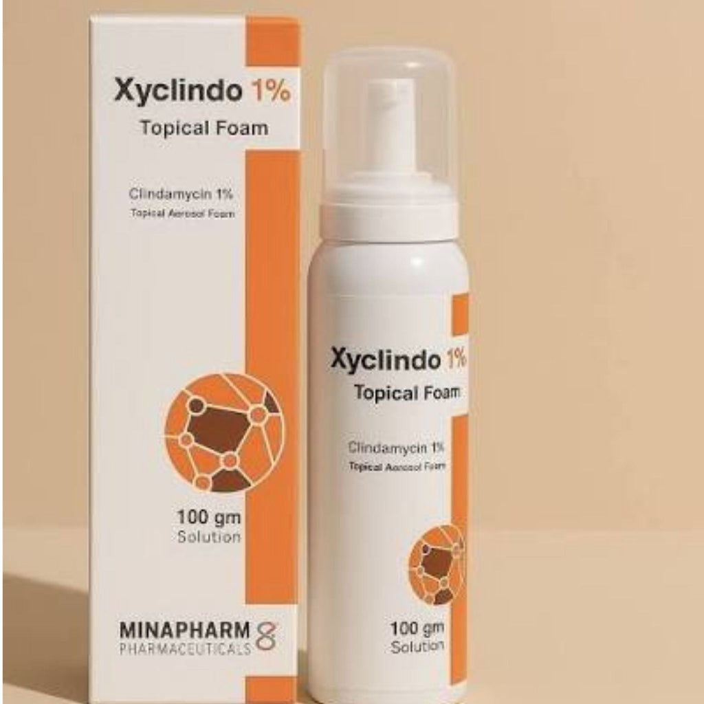 Refect Beauty MINAPHARM Xyclindo 1% topical acne foam in a white bottle and matching orange and white box.