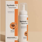 Refect Beauty MINAPHARM Xyclindo 1% topical acne foam in a white bottle and matching orange and white box.