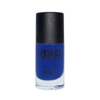 Refect Beauty Yolo creamy nail polish in a vibrant royal blue shade with a glossy finish in a glass bottle.