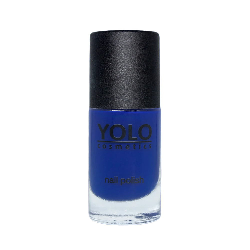 Refect Beauty Yolo creamy nail polish in a vibrant royal blue shade with a glossy finish in a glass bottle.