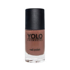 Refect Beauty Yolo Nail Polish in a creamy brown shade with a smooth glossy finish in a glass bottle.