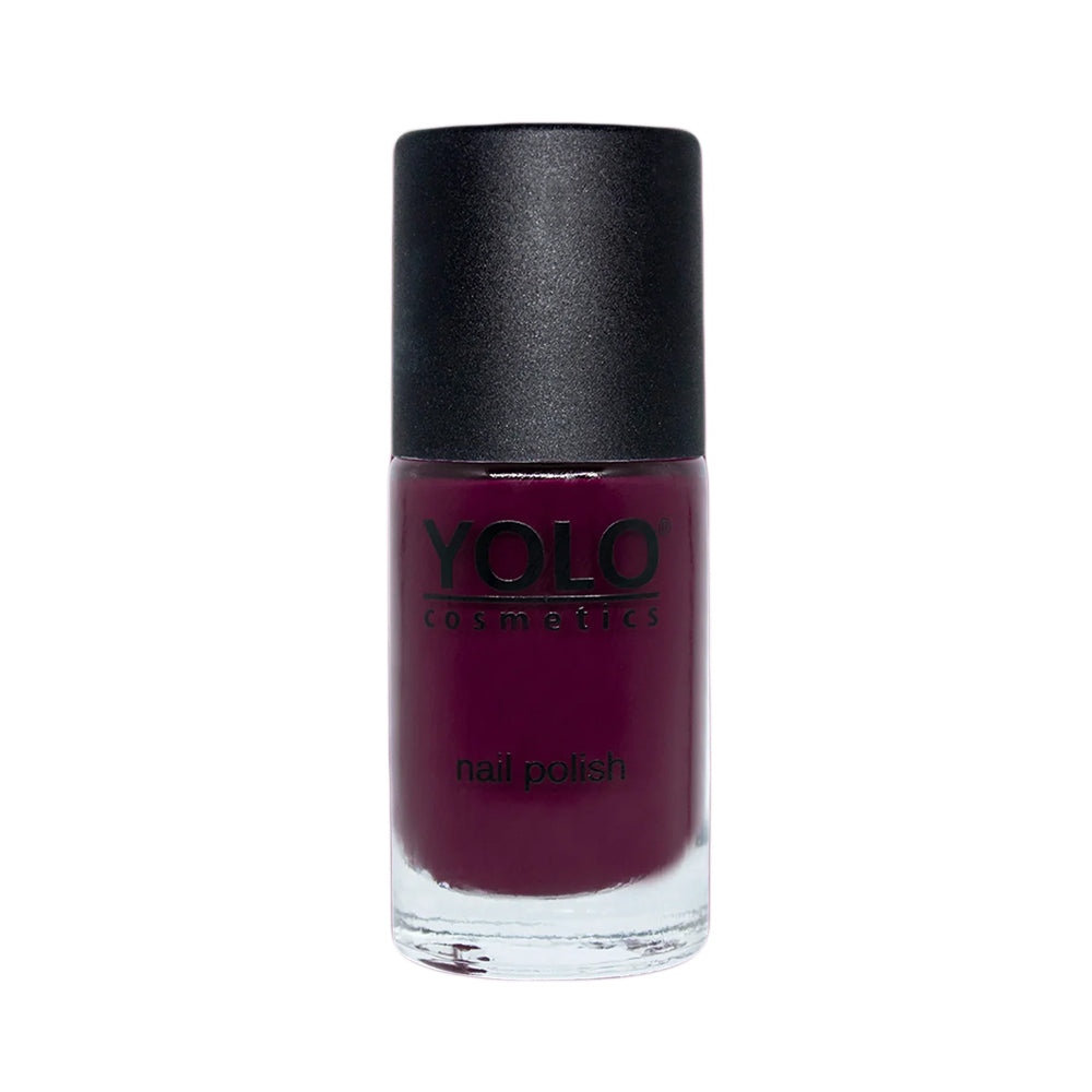 Refect Beauty Yolo creamy nail polish in a deep burgundy shade with a glossy finish in a glass bottle.