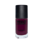 Refect Beauty Yolo creamy nail polish in a deep burgundy shade with a glossy finish in a glass bottle.