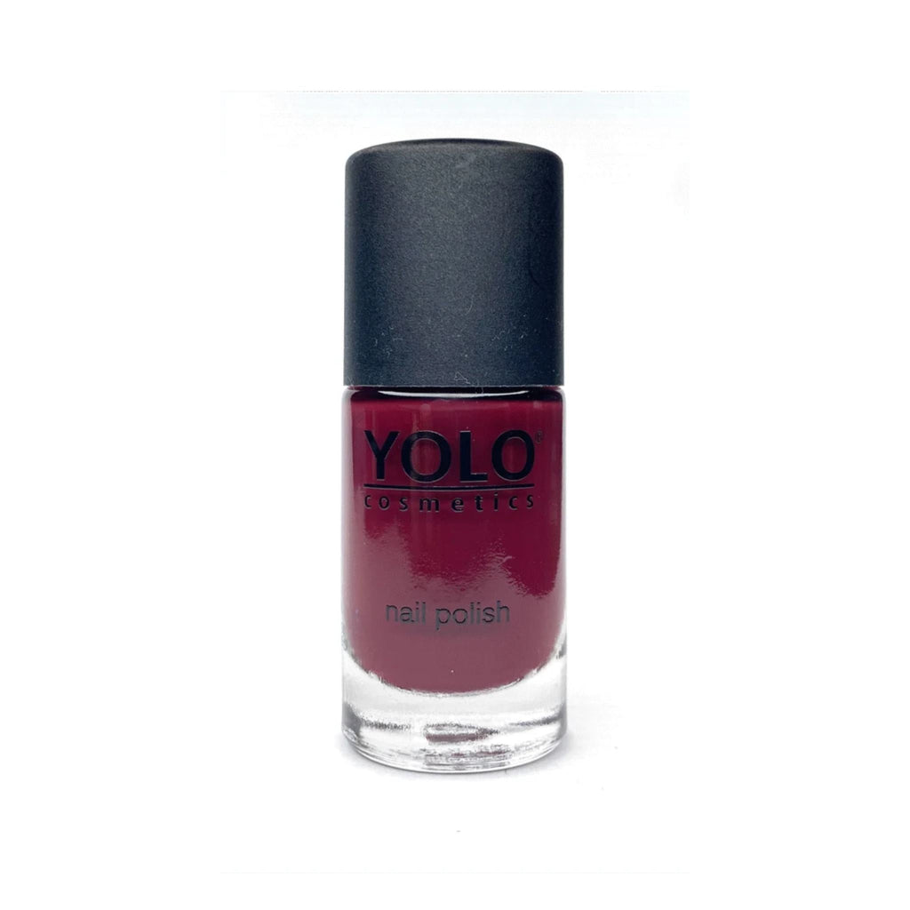 Refect Beauty YOLO nail polish in a deep burgundy shade with a high-gloss finish in a clear glass bottle.