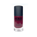 Refect Beauty YOLO nail polish in a deep burgundy shade with a high-gloss finish in a clear glass bottle.