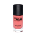Refect Beauty Yolo creamy nail polish in a soft coral pink shade with a smooth, glossy finish in a glass bottle.