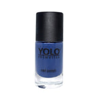 Refect Beauty Yolo Nail Polish in a rich, opaque blue shade with a smooth, glossy creamy finish in a glass bottle.