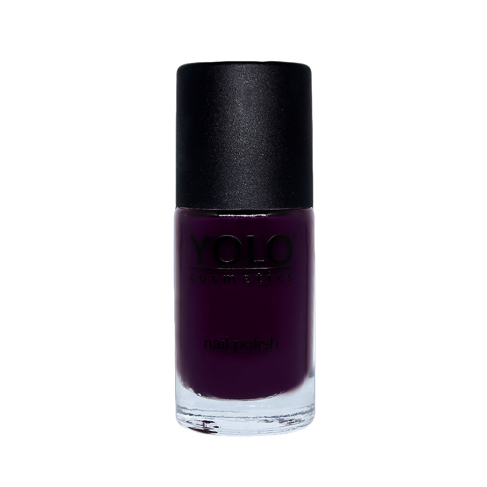 Refect Beauty Yolo creamy nail polish in a deep dark purple shade with a smooth glossy finish in a glass bottle.