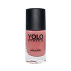 Refect Beauty Yolo Nail Polish in a dusty rose creamy shade with a sleek black cap in a glass bottle.