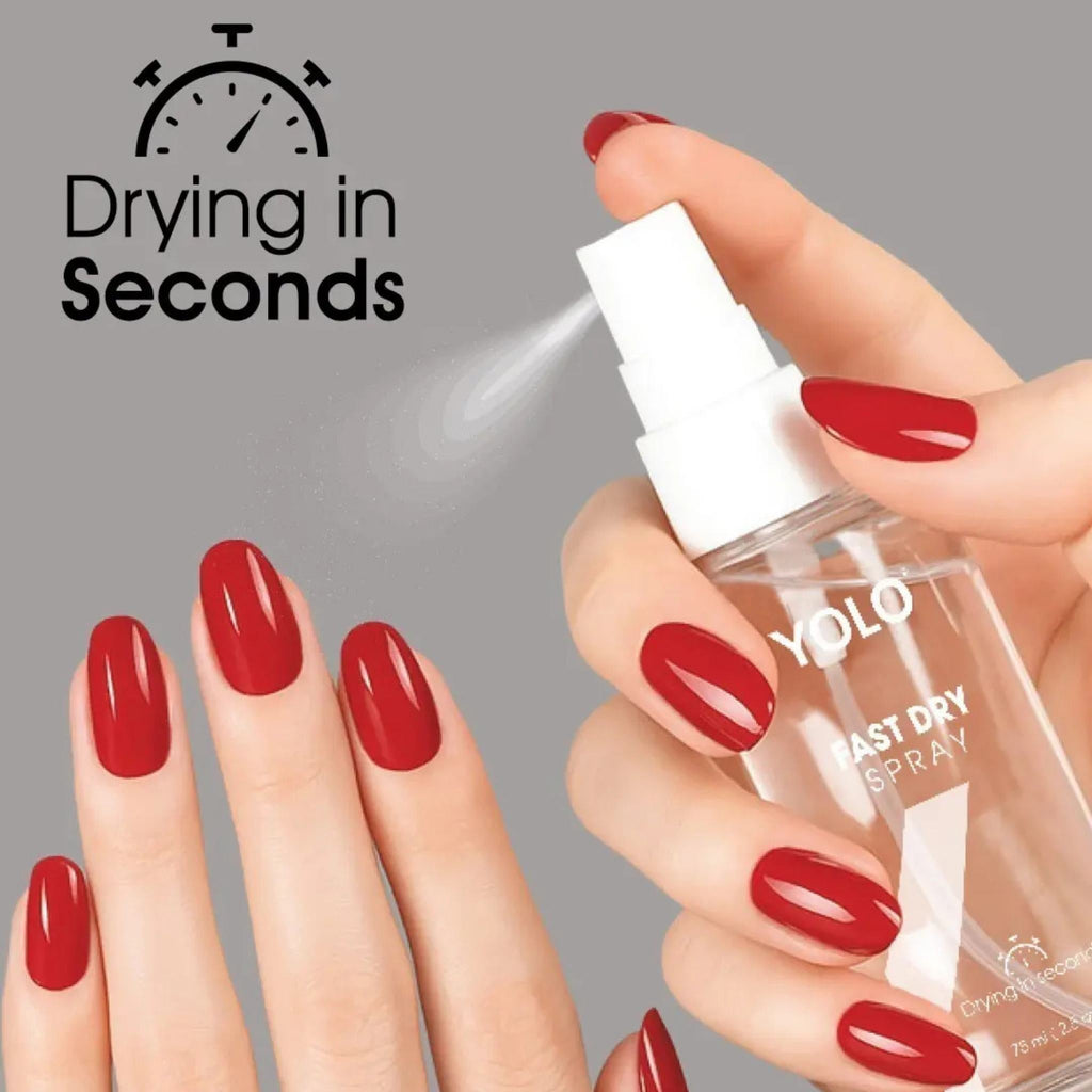 Refect Beauty Yolo Fast Dry Spray being applied to vibrant red manicured nails for a quick-drying glossy finish.
