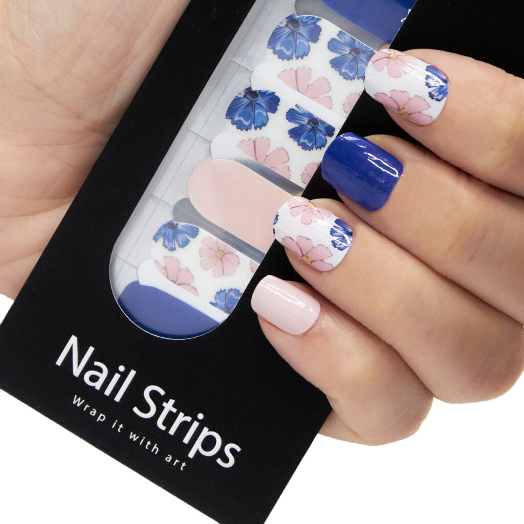 Refect Beauty Yolo Nail Strips featuring blue and pink floral patterns and solid navy and light pink nail wraps.