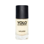 Refect Beauty Yolo glitter nail polish in a clear glass bottle with a black cap, featuring a shimmering gold finish.
