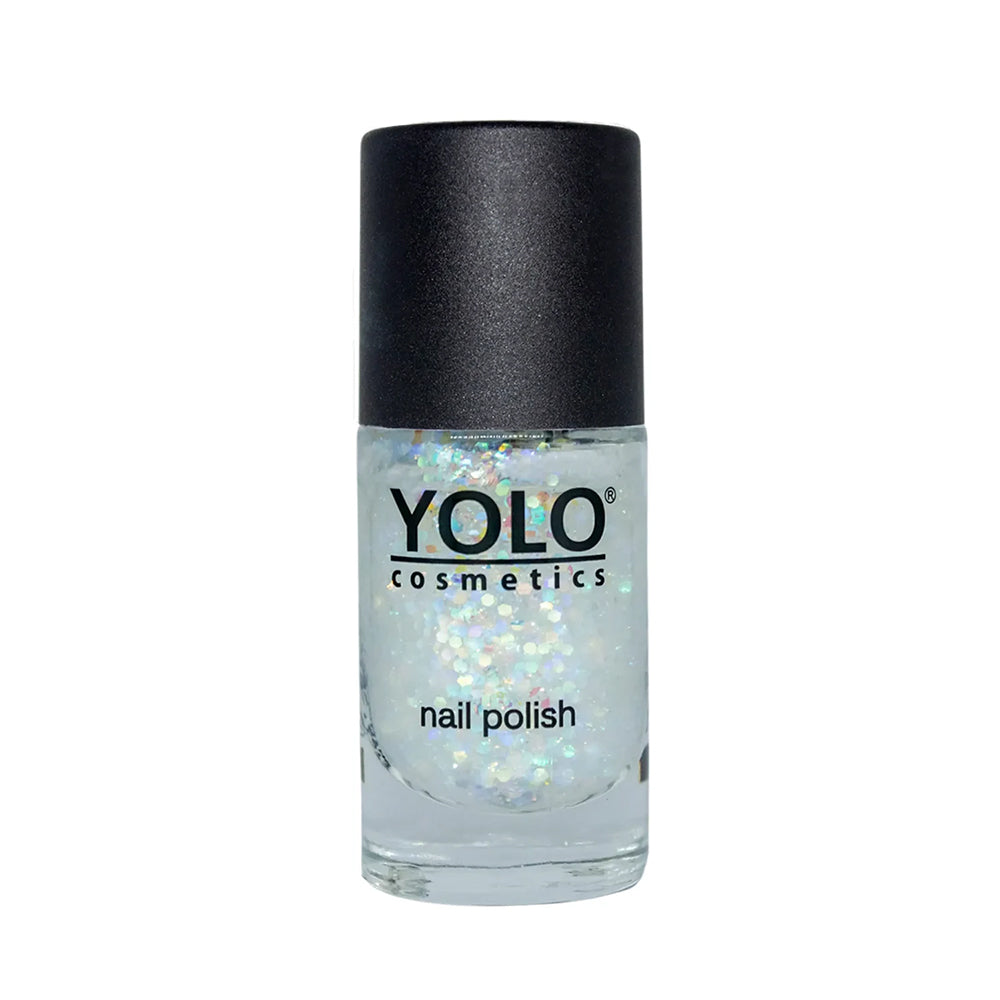Refect Beauty Yolo glitter nail polish in a clear bottle with holographic shimmer particles for a festive finish.