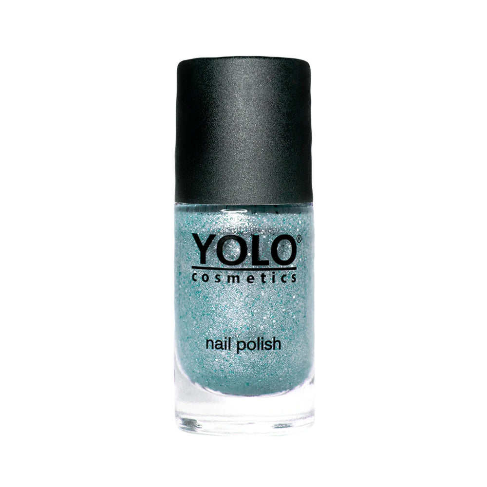 Refect Beauty Yolo glitter nail polish in a shimmering light blue shade with a black cap in a glass bottle.