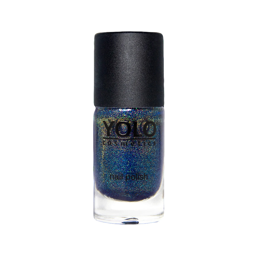 Refect Beauty Yolo glitter nail polish in a dark blue shimmering shade with a black cap in a glass bottle.