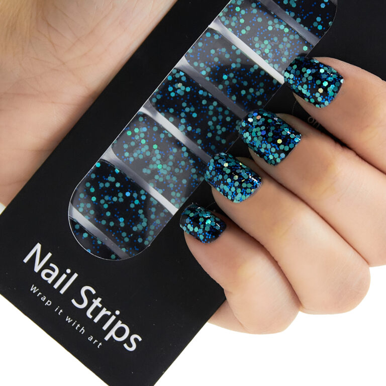 Refect Beauty Yolo nail strips featuring a black base with vibrant blue and teal glitter for a salon-style manicure