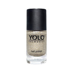 Refect Beauty Yolo glitter nail polish in a shimmering gold tone with a black cap in a glass bottle.