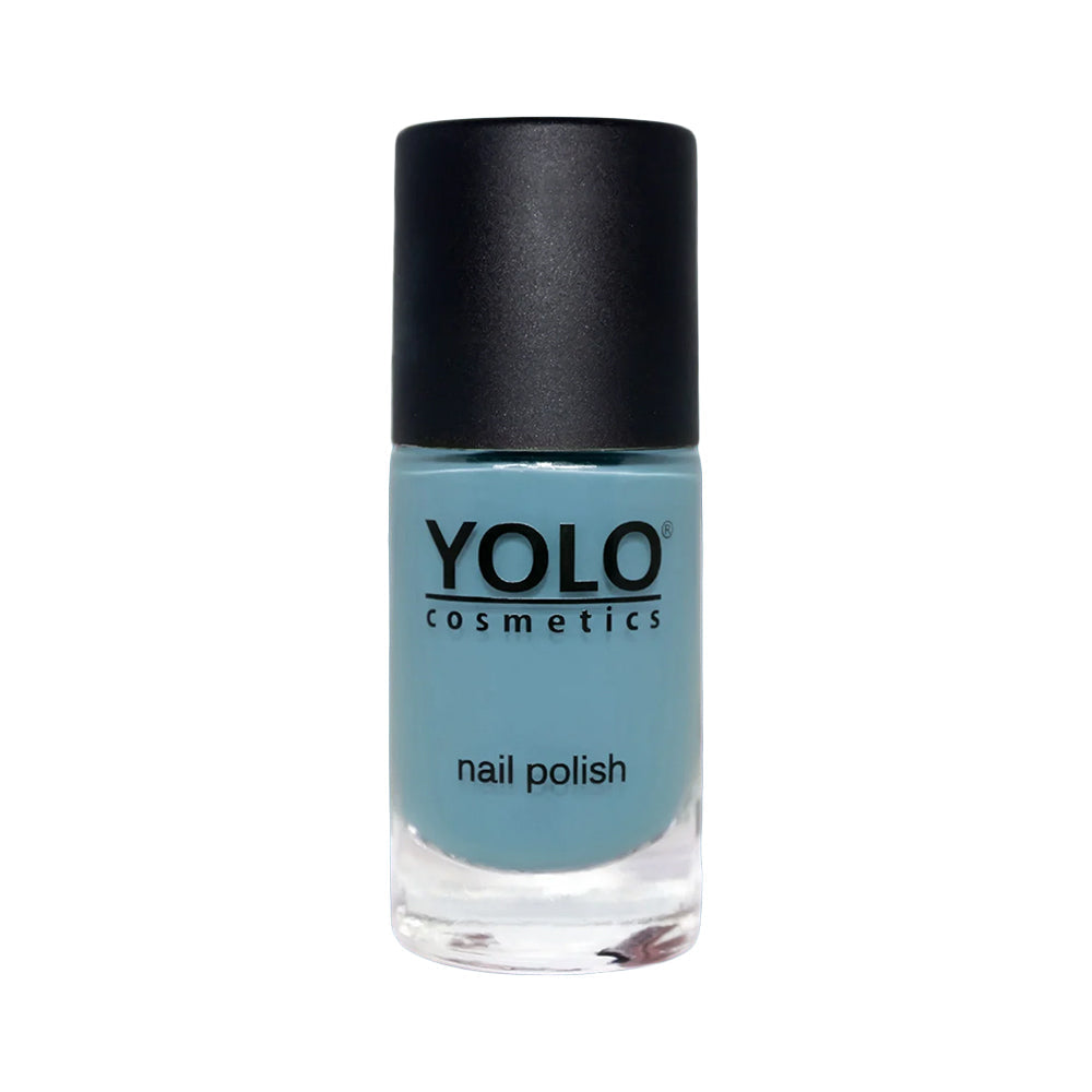 Refect Beauty Yolo creamy light blue nail polish in a glass bottle with a black cap for a glossy manicure.