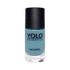Refect Beauty Yolo creamy light blue nail polish in a glass bottle with a black cap for a glossy manicure.