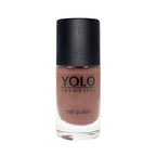 Refect Beauty Yolo Nail Polish in a creamy muted mauve shade with a smooth, glossy finish in a glass bottle.