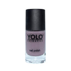 Refect Beauty Yolo Nail Polish in a muted mauve creamy shade with a black cap in a glass bottle.