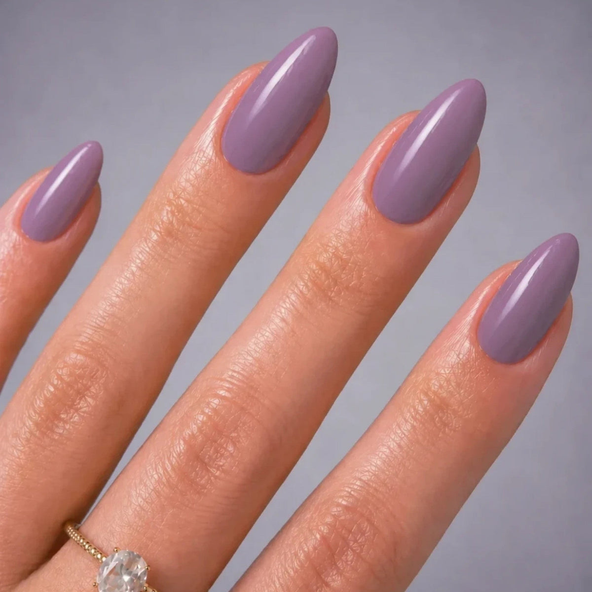 Refect Beauty Yolo shimmer nail polish in a soft mauve purple shade with a glossy finish on almond-shaped nails