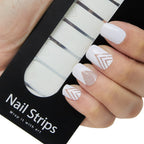 Refect Beauty Yolo nail strips featuring white and metallic geometric chevron designs applied to fingernails