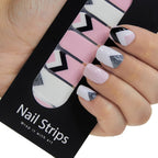 Refect Beauty Yolo Nail Strips featuring geometric black, white, pink, and silver glitter designs on manicured nails.
