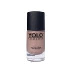 Refect Beauty YOLO nail polish in a shimmering nude beige shade with a high-gloss finish in a glass bottle.