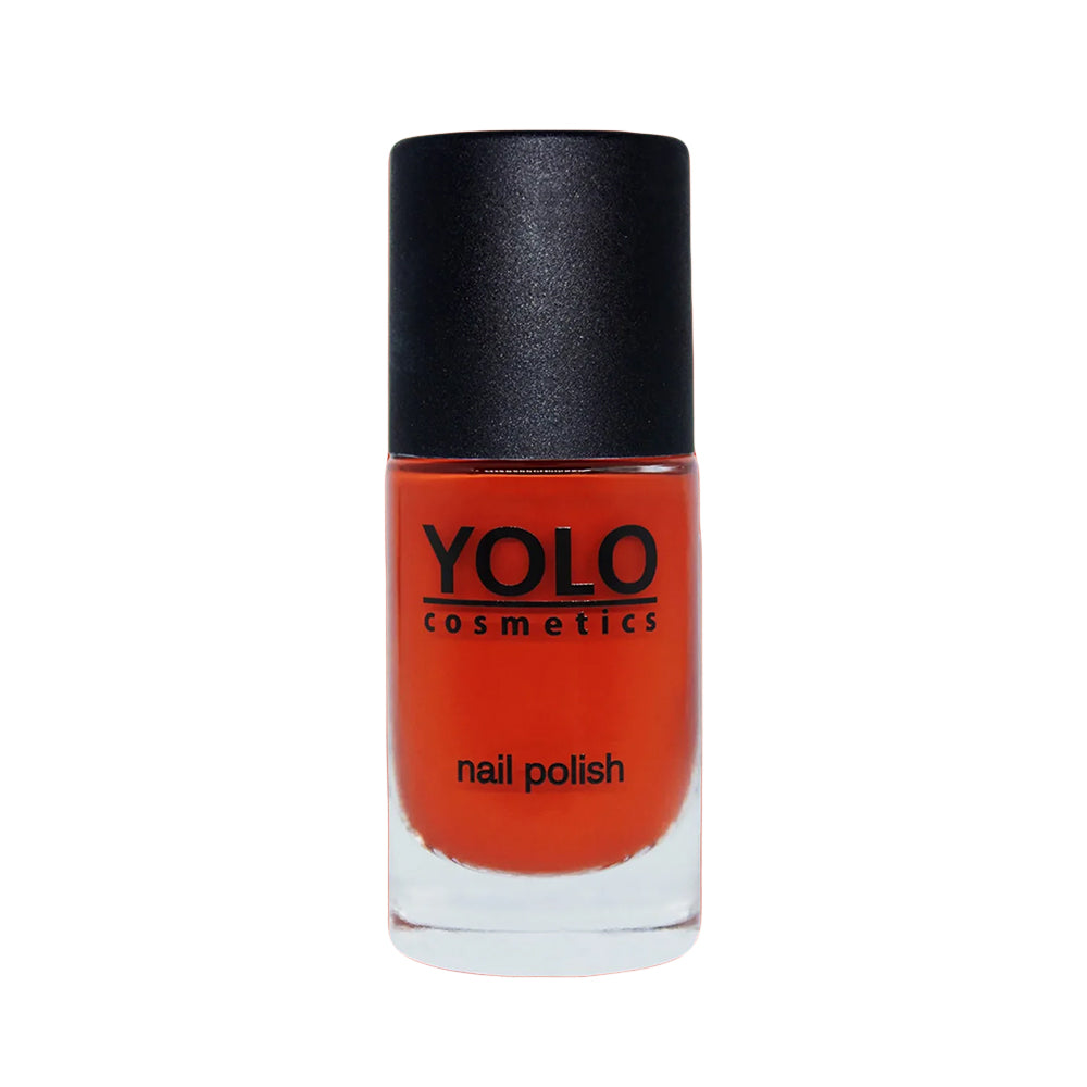 Refect Beauty Yolo creamy nail polish in a vibrant orange shade with a smooth glossy finish in a glass bottle.