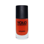 Refect Beauty Yolo creamy nail polish in a vibrant orange shade with a smooth glossy finish in a glass bottle.