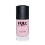 Refect Beauty Yolo pastel pink nail polish in a clear glass bottle with a black cap for a glossy manicure finish.