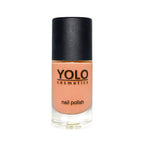 Refect Beauty Yolo Nail Polish in a soft peach creamy shade with a black cap in a clear glass bottle.
