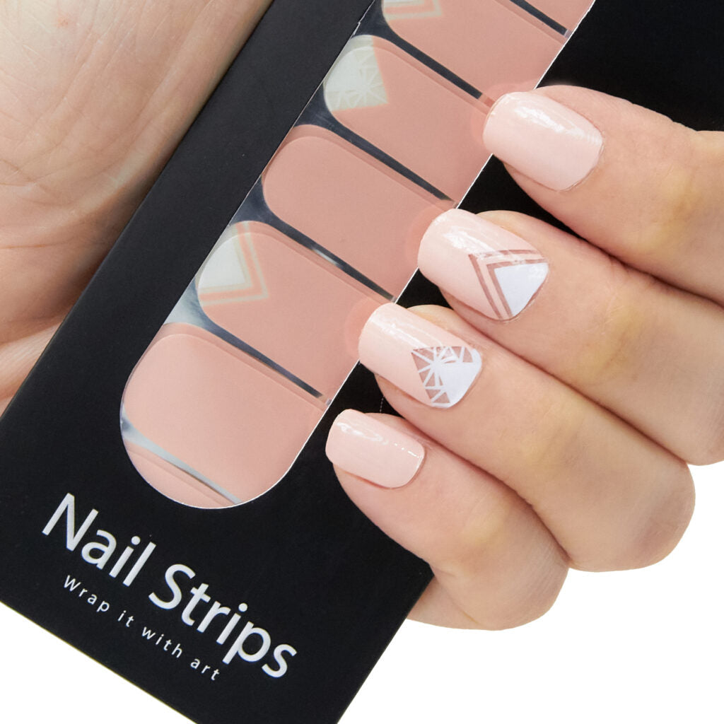 Refect Beauty Yolo nail strips featuring a soft pink base with white and metallic geometric chevron nail art designs