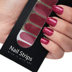 Refect Beauty Yolo nail strips featuring a vibrant pink glitter finish applied to fingers for a salon-style manicure.